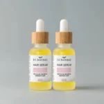 Nourishing Hair Serum Duo for smooth, shiny, and healthy-looking hair. Displayed against a light grey background.