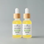 Nourishing Hair Serum Duo for smooth, shiny, and healthy-looking hair. Displayed against a light grey background.
