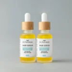 Nourishing Hair Serum Duo for smooth, shiny, and healthy-looking hair. Displayed against a light grey background.