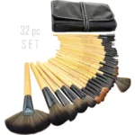 Complete 32-piece professional wooden makeup brush set with soft bristles and eco-friendly handles, ideal for flawless full-face makeup application. Displayed against a white background including a makeup brush pouch.