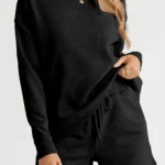 Close-up view of Adalyn loungewear set featuring a textured long sleeve top and matching drawstring shorts, cozy and stylish two-piece lounge outfit for women.