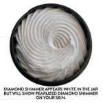 An open jar of organic diamond shimmer whipped body butter with a silky, glowing finish for radiant, hydrated skin."