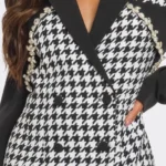 Close up view of chic Monochrome Glam Houndstooth Blazer Dress featuring a bold black-and-white pattern, tailored fit, and sophisticated design — a statement look for modern, confident women by BeautyPlusFashion.