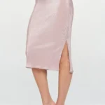 Elegant Made in USA solid plissé midi skirt with side slit, showcasing lightweight pleated texture and timeless chic design — perfect for day-to-night wear by BeautyPlusFashion.