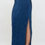 Side view of Made in USA plissé maxi skirt with slit for women, flowy and elegant, ideal for casual or party wear.