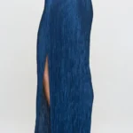 Side view of Made in USA plissé maxi skirt with slit for women, flowy and elegant, ideal for casual or party wear.