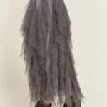 Side view of stylish layered polka dot mesh lined midi skirt for women, flowy and elegant, perfect for casual or party wear.