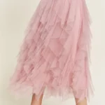 Side view of stylish layered polka dot mesh lined midi skirt for women, flowy and elegant, perfect for casual or party wear.