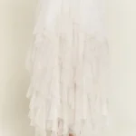 Back view of stylish layered polka dot mesh lined midi skirt for women, flowy and elegant, perfect for casual or party wear.