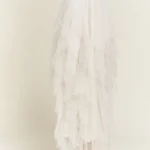 Side view of stylish layered polka dot mesh lined midi skirt for women, flowy and elegant, perfect for casual or party wear.