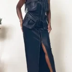 Close-up of Athina black leather dress showing button details and structured fit