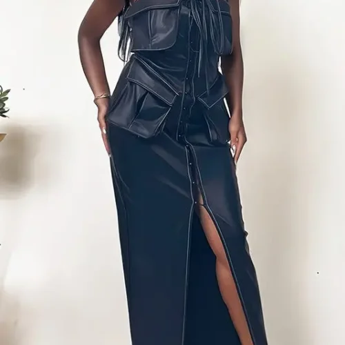 Close-up of Athina black leather dress showing button details and structured fit