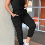 Front view of crew neck short sleeve jumpsuit with drawstring waist, lightweight summer one-piece outfit for women.
