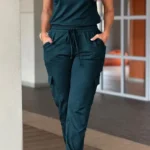 Front view of crew neck short sleeve jumpsuit with drawstring waist, lightweight summer one-piece outfit for women.