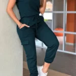 Front view of crew neck short sleeve jumpsuit with drawstring waist, lightweight summer one-piece outfit for women.