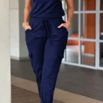 Front view of crew neck short sleeve jumpsuit with drawstring waist, lightweight summer one-piece outfit for women.