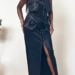 Close-up of Athina black leather dress showing button details and structured fit