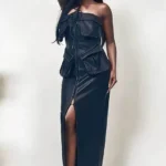 Athina black PU leather dress with button detailing, fitted silhouette, and chic design