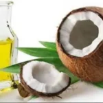 Fresh opened coconut showing natural moisturizing ingredient used in organic Vitamin A night cream. Coconut halves with white flesh – natural source of hydration and nourishment in organic skincare.