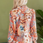 Back view of the Leighton Floral Button Loose Shirt highlighting the lightweight fabric, flowy drape, and full floral pattern coverage.