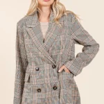 Model wearing Mittoshop plaid double-breasted blazer buttoned up with relaxed fit and chic styling