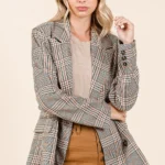 Model wearing Mittoshop Plaid Double-Breasted Relaxed Fit Blazer styled with trousers .