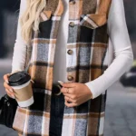 Model wearing straw yellow retro plaid button-up collared vest with white shirt