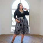 Model wearing knee-length circle skirt with side pocket styled with tucked blouse for classic everyday look — BeautyPlusFashion.