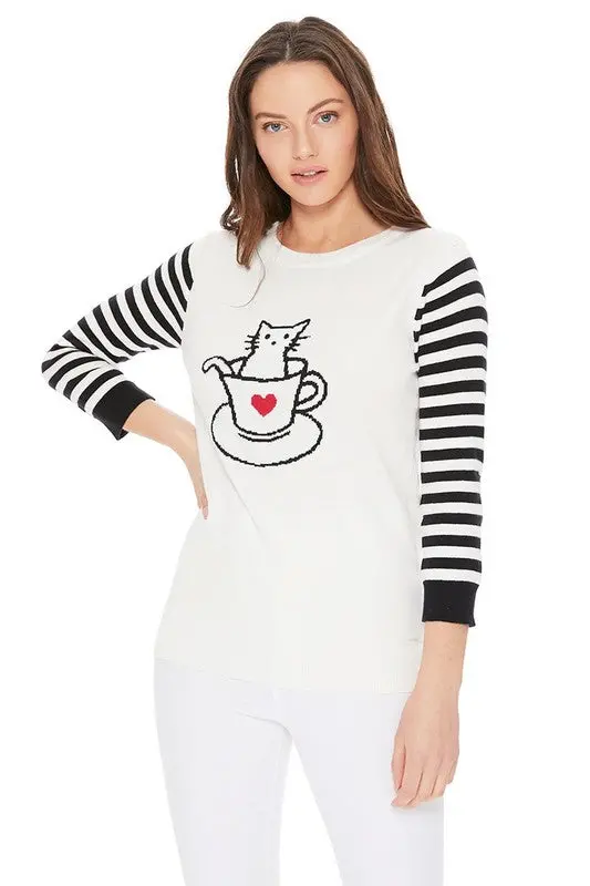 Front view of women’s jacquard sweater featuring adorable cat in cup design