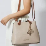 Model carrying MKF Kearny Women’s Tote Handbag over shoulder, showcasing versatile and elegant everyday style
