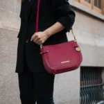 MKF Collection Raelynn Women's Shoulder Bag worn over model's shoulder – stylish vegan leather handbag showcasing chic designer-inspired look by BeautyPlusFashion