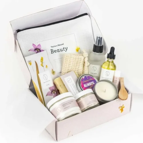 Open lavender bath and body spa gift box showing aromatherapy self-care products neatly packaged for relaxation and stress relief.