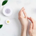 Woman applying lavender shea butter body cream to hands for smooth hydrated skin