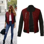 Woman wearing a chic quilted satin bomber jacket unzipped, showing a relaxed layered look.
