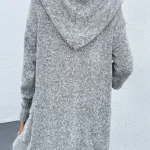 Back view of gray knit hooded cardigan showcasing soft textured knit fabric, relaxed fit silhouette, long sleeves, and attached hood for a cozy and stylish fall or winter layering piece.