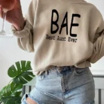 Model wearing a BAE Best Aunt Ever sweatshirt for women with cozy fabric and relaxed fit, styled for casual everyday wear.