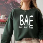 Model wearing a BAE Best Aunt Ever sweatshirt for women with cozy fabric and relaxed fit, styled for casual everyday wear.