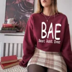 Model wearing a BAE Best Aunt Ever sweatshirt for women with cozy fabric and relaxed fit, styled for casual everyday wear.