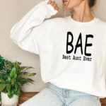 Model wearing a BAE Best Aunt Ever sweatshirt for women with cozy fabric and relaxed fit, styled for casual everyday wear.