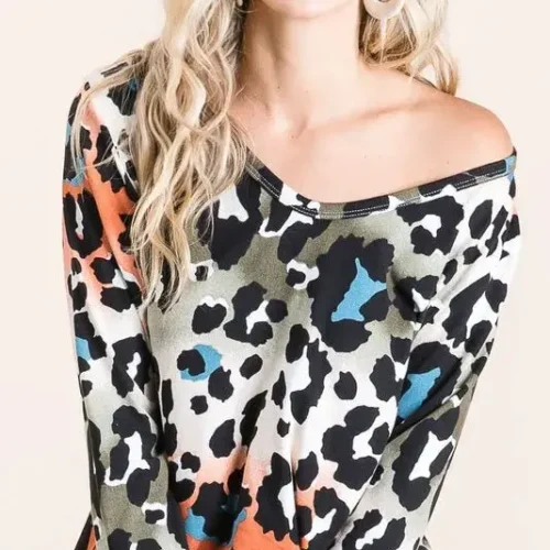 Model wearing a soft leopard print u neck top with lightweight fabric and relaxed fit, styled for casual everyday fashion.