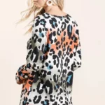 Back view of a leopard print u neck shirt highlighting comfortable fit and lightweight drape.