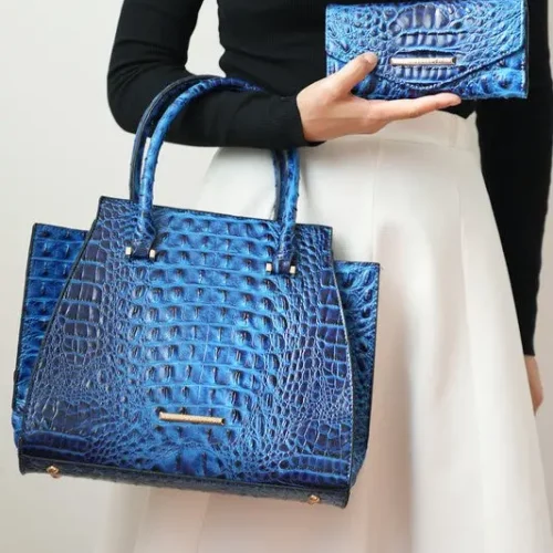 Model carrying the MKF Collection Viridiana Croc-Embossed Tote Bag over her arm while holding a matching hand clutch, showcasing the coordinated croc-embossed design, structured silhouette, and versatile, stylish accessories for everyday or special occasions.