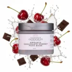 Organic chocolate cherry face mask in a closed jar surrounded by fresh cherries and chocolate squares, antioxidant-rich clean beauty treatment designed to hydrate, brighten, and promote radiant, healthy-looking skin.