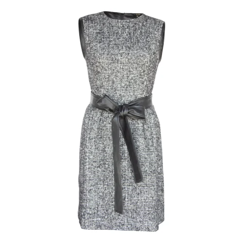 Luxury ebony tweed mini dress showcasing sophisticated boutique fashion with a classic black tweed fabric and modern feminine fit