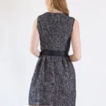 Back view of ebony mini tweed dress showing tailored silhouette and elegant black tweed texture