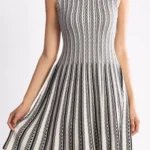 Jacquard sweater knitted dress styled on a model, featuring soft textured knit fabric, long sleeves, and elegant jacquard pattern, showcasing a cozy, relaxed-fit look perfect for fall and winter fashion.