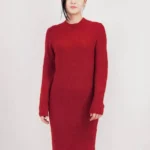 Loose fit textured midi sweater dress in soft knit fabric, styled on a mannequin or model, showcasing cozy, oversized design and chic midi length perfect for fall and winter layering.