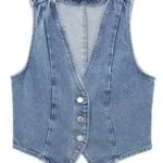 Detailed product shot of cropped denim vest showing front buttons and structured cropped design