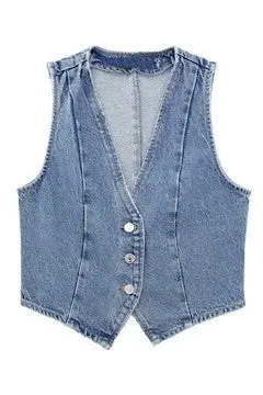 Detailed product shot of cropped denim vest showing front buttons and structured cropped design