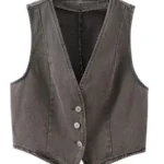 Detailed product shot of cropped denim vest showing front buttons and structured cropped design